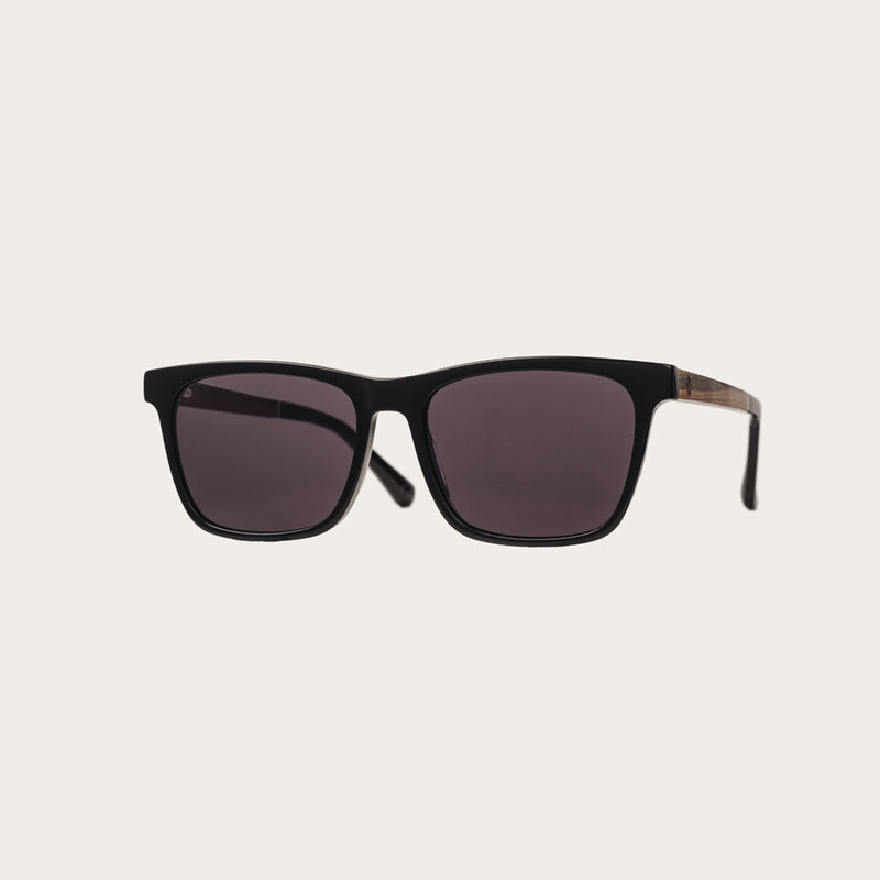 The BROOKLYN All Black features a squared black frame with black lenses. Composed of durable Italian Mazzucchelli bio-acetate with hand-finished natural rosewood temples and black acetate tips. Bio-acetate is made from cotton and organic resins making our