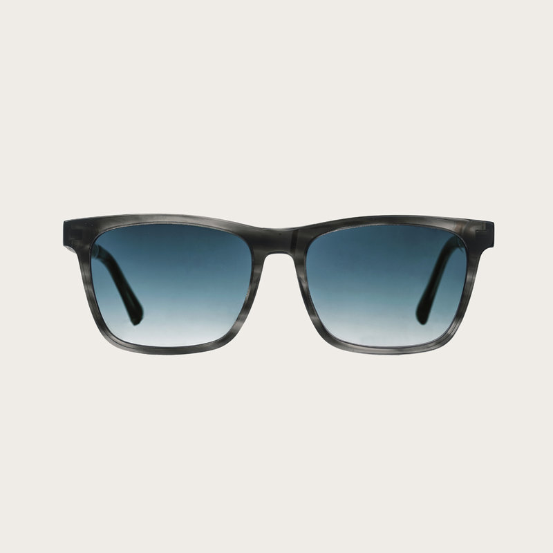 The BROOKLYN Heritage Gradient Blue features a squared grey tortoise frame with gradient blue lenses. Composed of durable Italian Mazzucchelli bio-acetate with hand-finished natural zebrawood temples and tortoise acetate tips. Bio-acetate is made from cot