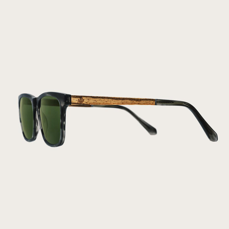 The BROOKLYN Heritage Camo features a squared grey tortoise frame with green camo lenses. Composed of durable Italian Mazzucchelli bio-acetate with hand-finished natural zebrawood temples and tortoise acetate tips. Bio-acetate is made from cotton and orga