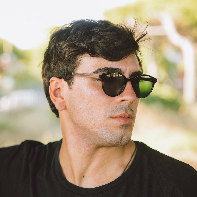 The SOHO Forever Havanas Camo features an oval dark brown tortoise frame with green camo lenses. Composed of durable Italian Mazzucchelli bio-acetate with hand-finished natural ebony temples and tortoise acetate tips. Bio-acetate is made from cotton and o