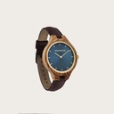 The AURORA Collection breaths the fresh air of Scandinavian nature and the astonishing views of the sky. This light weighing watch is made of kosso wood, accompanied by a blue stainless-steel dial with golden details.<br />
The watch is available with a wooden
