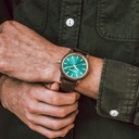 The Camo Walnut features a modernized minimal green dial with bold details in a 45mm case. A wrist essential combining natural wood with stainless steel and sapphire coated glass. The Camo Walnut is handmade from American Walnut Wood.
