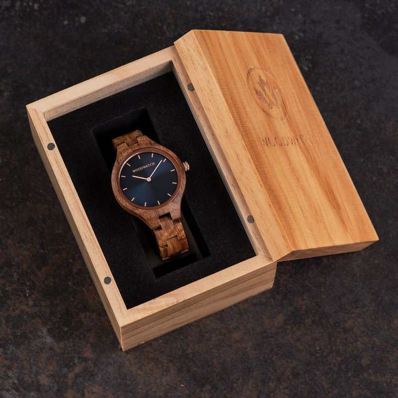 The AURORA Collection breaths the fresh air of Scandinavian nature and the astonishing views of the sky. This light weighing watch is made of East African Kosso wood, accompanied by a blue stainless-steel dial with shining rose gold details. The watch is