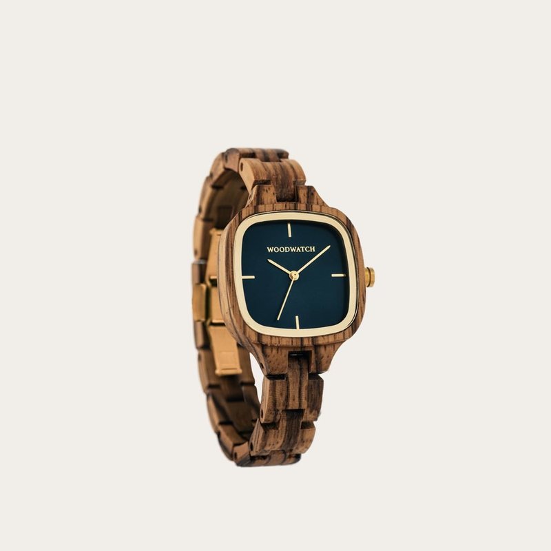 The CITY Skylight features a 30mm square case with a blue dial and golden details. The watch band consists of natural zebra wood that has been hand-finished to perfection and to create our latest small-band design.