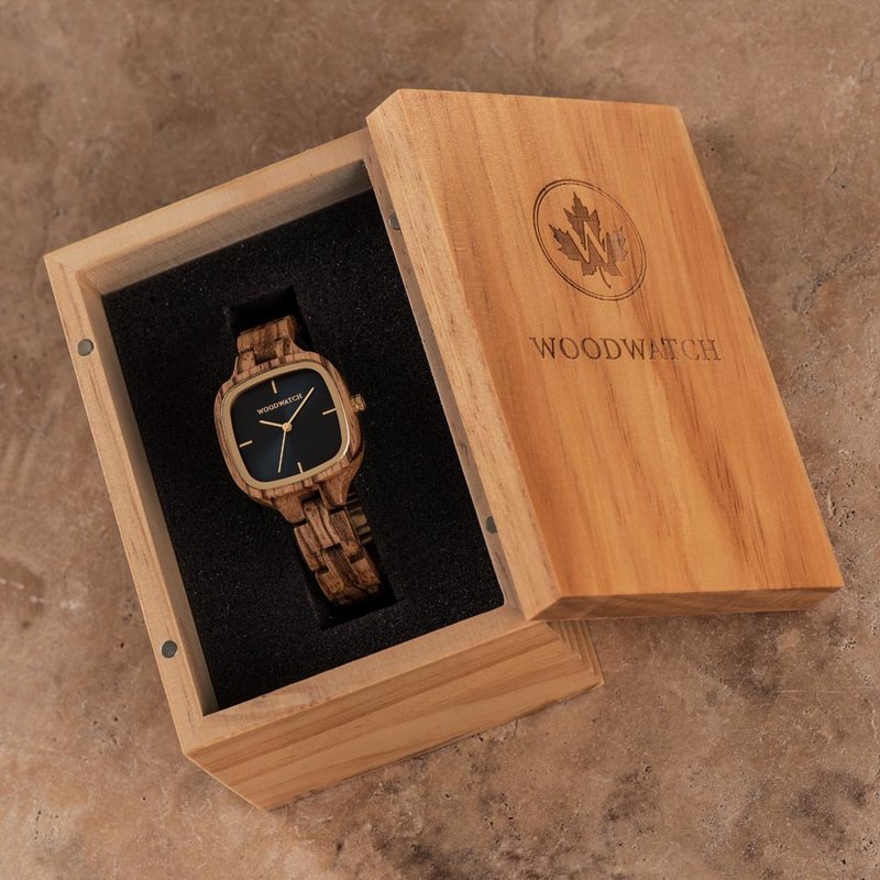 The CITY Skylight features a 30mm square case with a blue dial and golden details. The watch band consists of natural zebra wood that has been hand-finished to perfection and to create our latest small-band design.