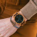 The Reveler Kosso features a modernized minimal grey dial with bold details in a 45mm case. A wrist essential combining natural wood with stainless steel and sapphire coated glass. The Reveler Kosso is handmade from natural Kosso wood from East Africa.