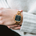 The CITY Skylight features a 30mm square case with a blue dial and golden details. The watch band consists of natural zebra wood that has been hand-finished to perfection and to create our latest small-band design.