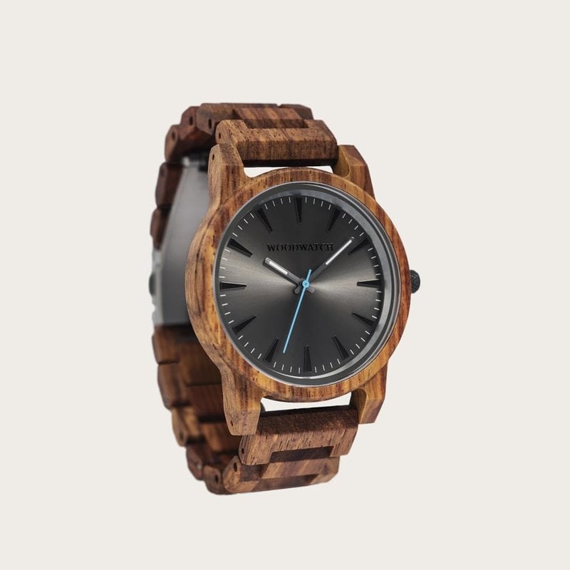 The Reveler Kosso features a modernized minimal grey dial with bold details in a 45mm case. A wrist essential combining natural wood with stainless steel and sapphire coated glass. The Reveler Kosso is handmade from natural Kosso wood from East Africa.