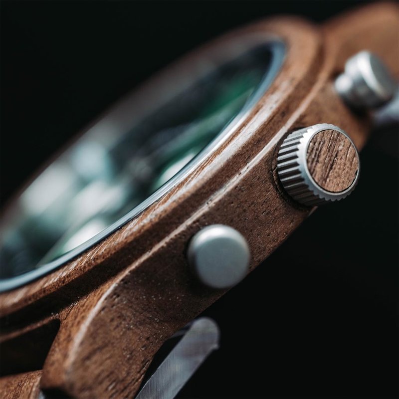 The Chrono Hunter is made from walnut wood and features a double layered dark green dial with silver details.