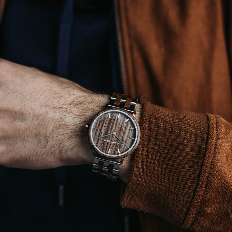 A renewed MINIMAL design with a timeless look that matches any occasion. Featuring a thin, steel case, and walnut bezel and dial. Comes with a new watch strap, designed from the ground up to perfectly match the minimal watch case in style and materials.