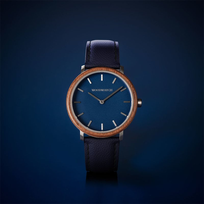 A renewed MINIMAL design with a timeless look that matches any occasion. Featuring a thin, steel case, and walnut bezel and blue dial. Comes with a new watch strap, designed from the ground up to perfectly match the minimal watch case in style and materia