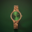 The AURORA Collection breaths the fresh air of Scandinavian nature and the astonishing views of the sky. This light weighing watch is made of olive wood, accompanied by a green stainless-steel dial with golden details.<br />
The watch is available with a woode
