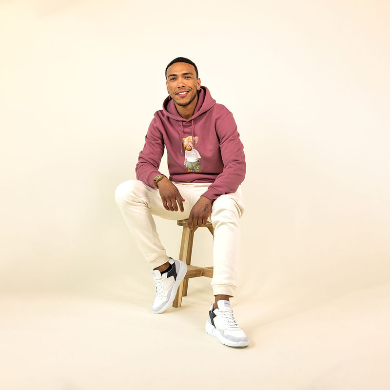 Soft unisex long-sleeved hoodie with a double layered hood and a kangaroo pocket at the front. Made of 85% organic cotton and 15% recycled polyester, featuring a full body Harvey print.