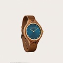 The AURORA Collection breaths the fresh air of Scandinavian nature and the astonishing views of the sky. This light weighing watch is made of kosso wood, accompanied by a blue stainless-steel dial with golden details.<br />
Comes with a cactus leather strap in