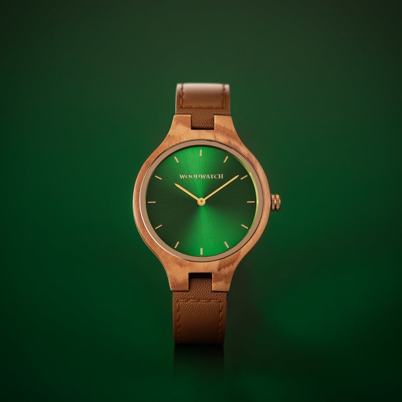 The AURORA Collection breaths the fresh air of Scandinavian nature and the astonishing views of the sky. This light weighing watch is made of olive wood, accompanied by a green stainless-steel dial with golden details.<br />
Comes with a cactus leather strap i