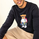 Soft unisex long-sleeved sweater with a round neck. Made of 85% organic cotton and 15% recycled polyester, featuring a full body Harvey print.