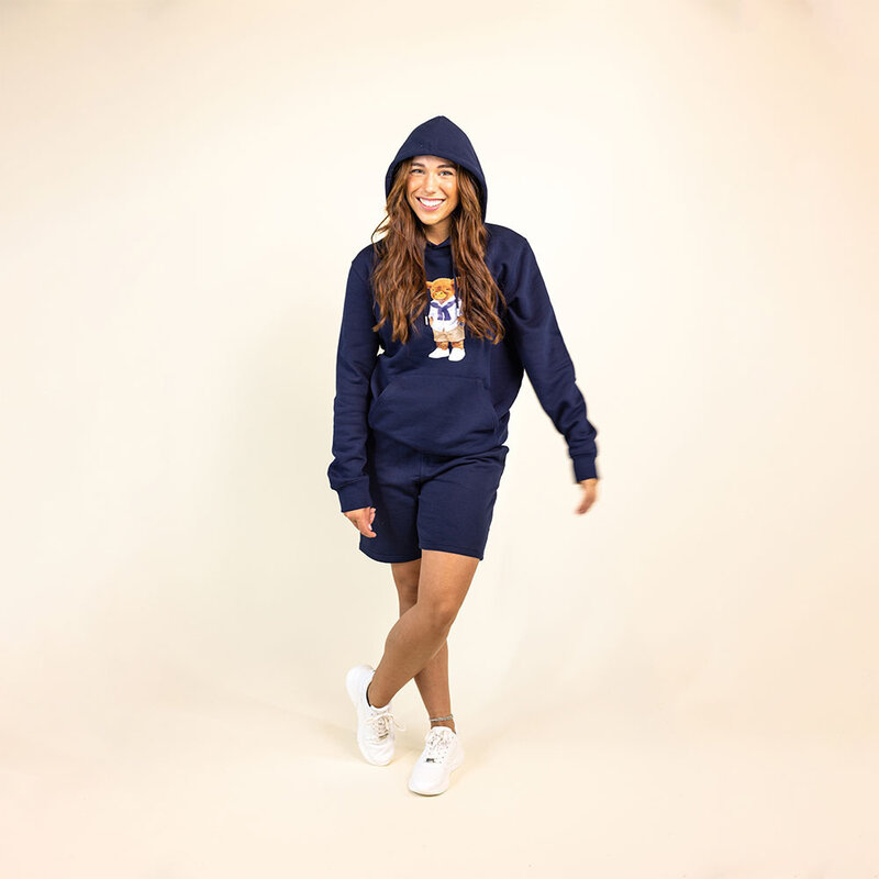 Soft unisex long-sleeved hoodie with a double layered hood and a kangaroo pocket at the front. Made of 85% organic cotton and 15% recycled polyester, featuring a full body Harvey print.