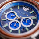Apex Elite: Sophisticated wooden watches for men. Features Japanese Movement, chronograph, stainless steel, natural wood, blue dial. Durable and stylish.