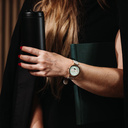 The Selene Mint Essence is crafted from walnut wood, featuring a mint green dial, brown vegan strap, and golden details.