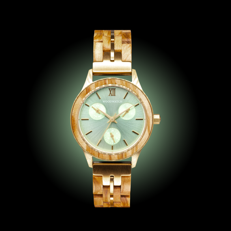 The Radiance Emerald Elegance is crafted from olive wood and stainless steel brushed gold, featuring a green dial and brushed gold metal details.