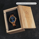 The AURORA Collection breaths the fresh air of Scandinavian nature and the astonishing views of the sky. This light weighing watch is made of kosso wood, accompanied by a blue stainless-steel dial with golden details.<br />
The watch is available with a wooden