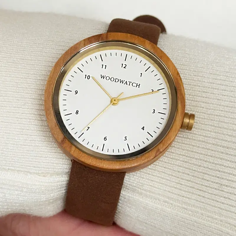 Inspired by contemporary Nordic minimalism. The NORDIC Copenhagen features a 36mm diameter white olive wood case with a white dial and gold details. Handmade from sustainably sourced wood and combined with an ultra soft beige sustainable vegan leather str