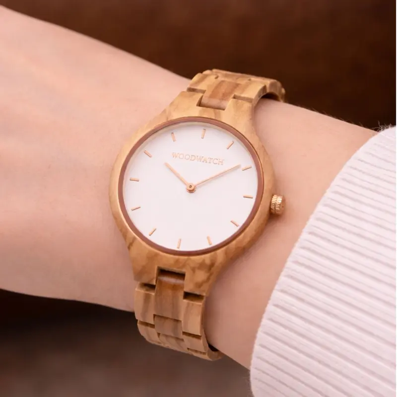 The AURORA Collection breaths the fresh air of Scandinavian nature and the astonishing views of the sky. This light weighing watch is made of European Olive Wood, accompanied by a light stainless-steel dial with a rose gold highlight and shining rose gold