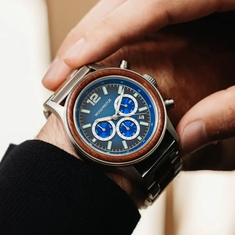 Apex Elite: Sophisticated wooden watches for men. Features Japanese Movement, chronograph, stainless steel, natural wood, blue dial. Durable and stylish.