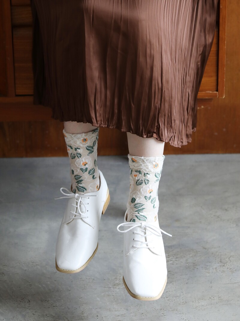 Calcetines de lana merino con estampado Camelia flotante