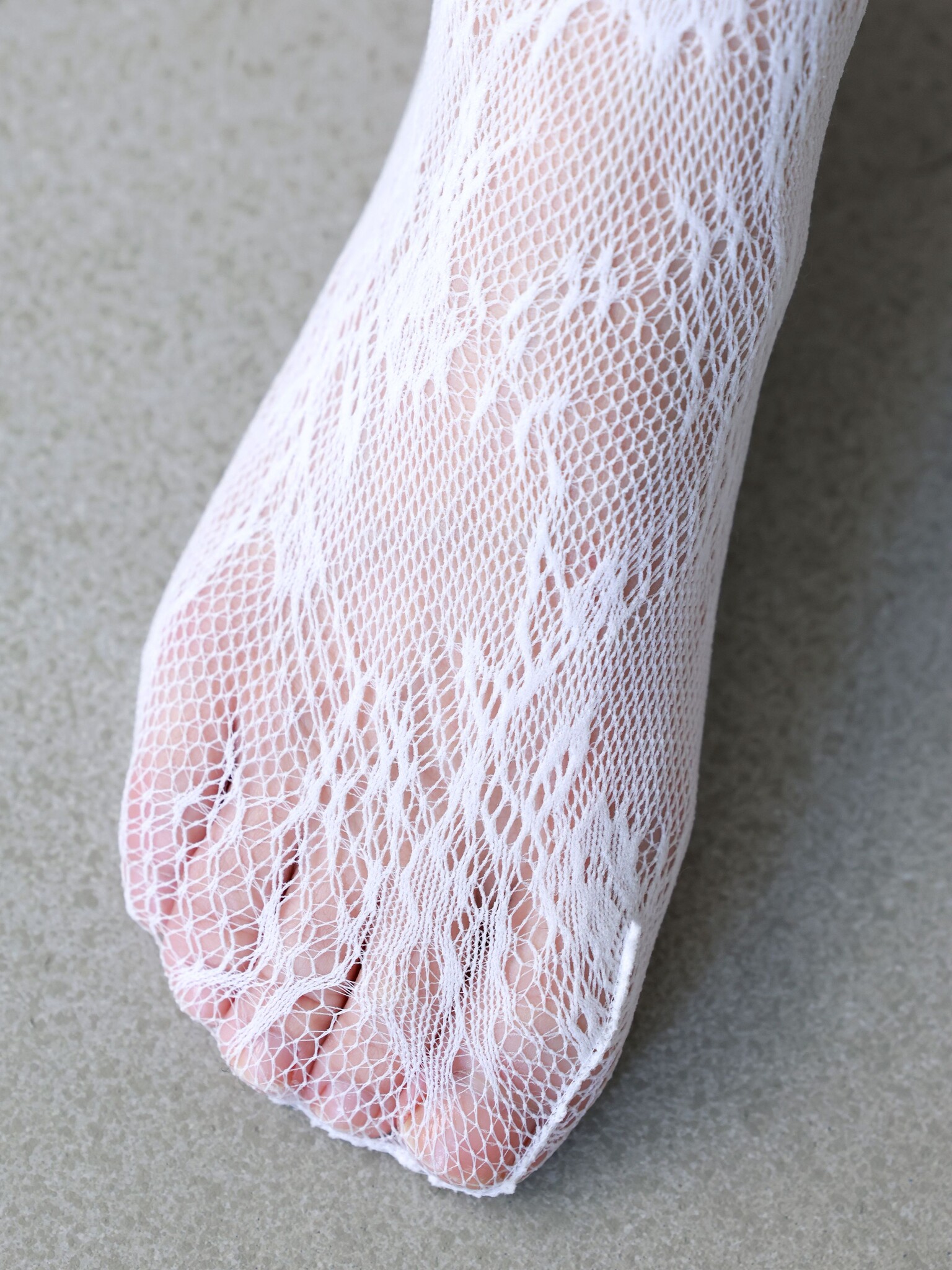 Collant Raschel fleurs en dentelle