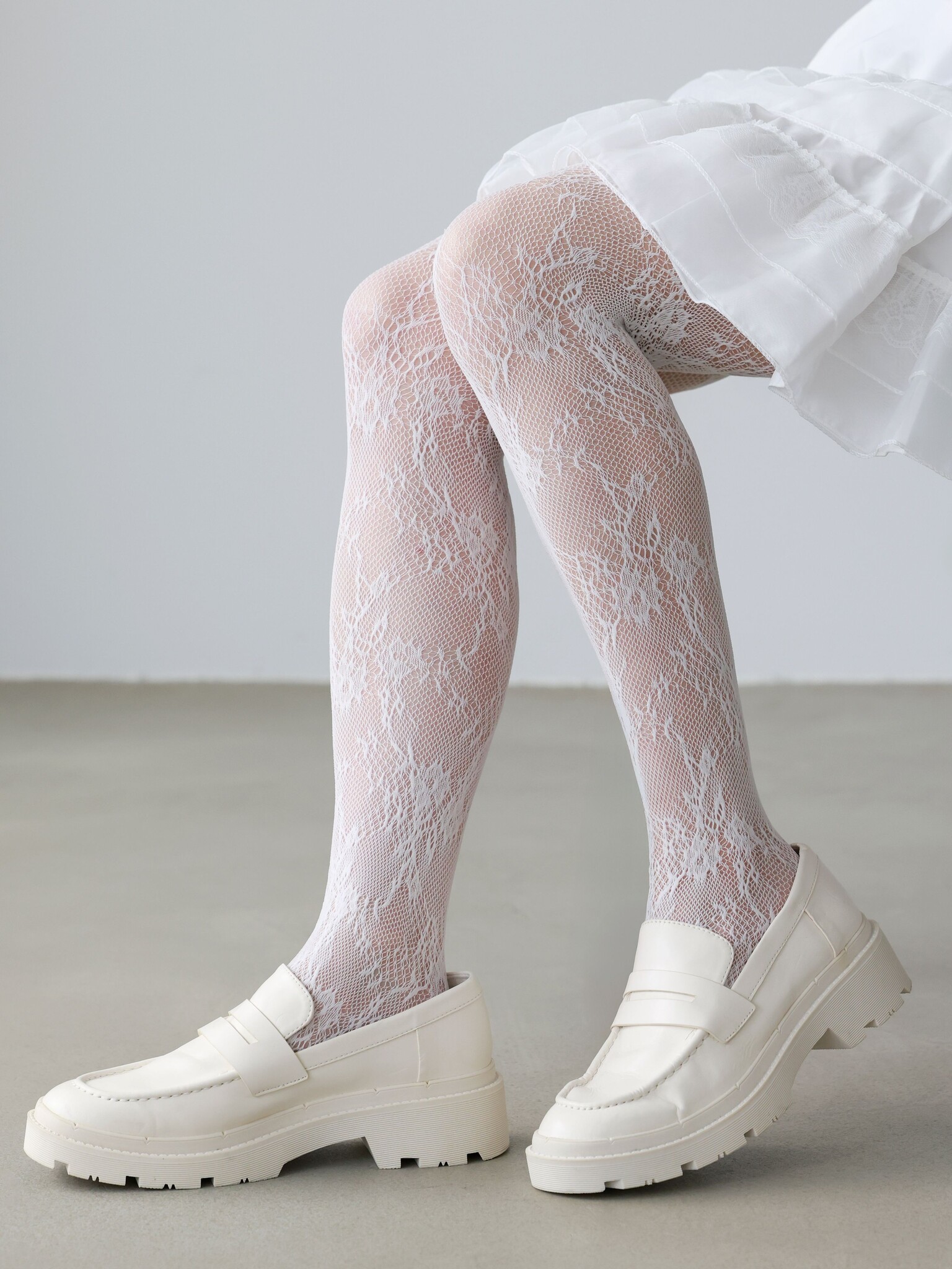 Collant Raschel fleurs en dentelle