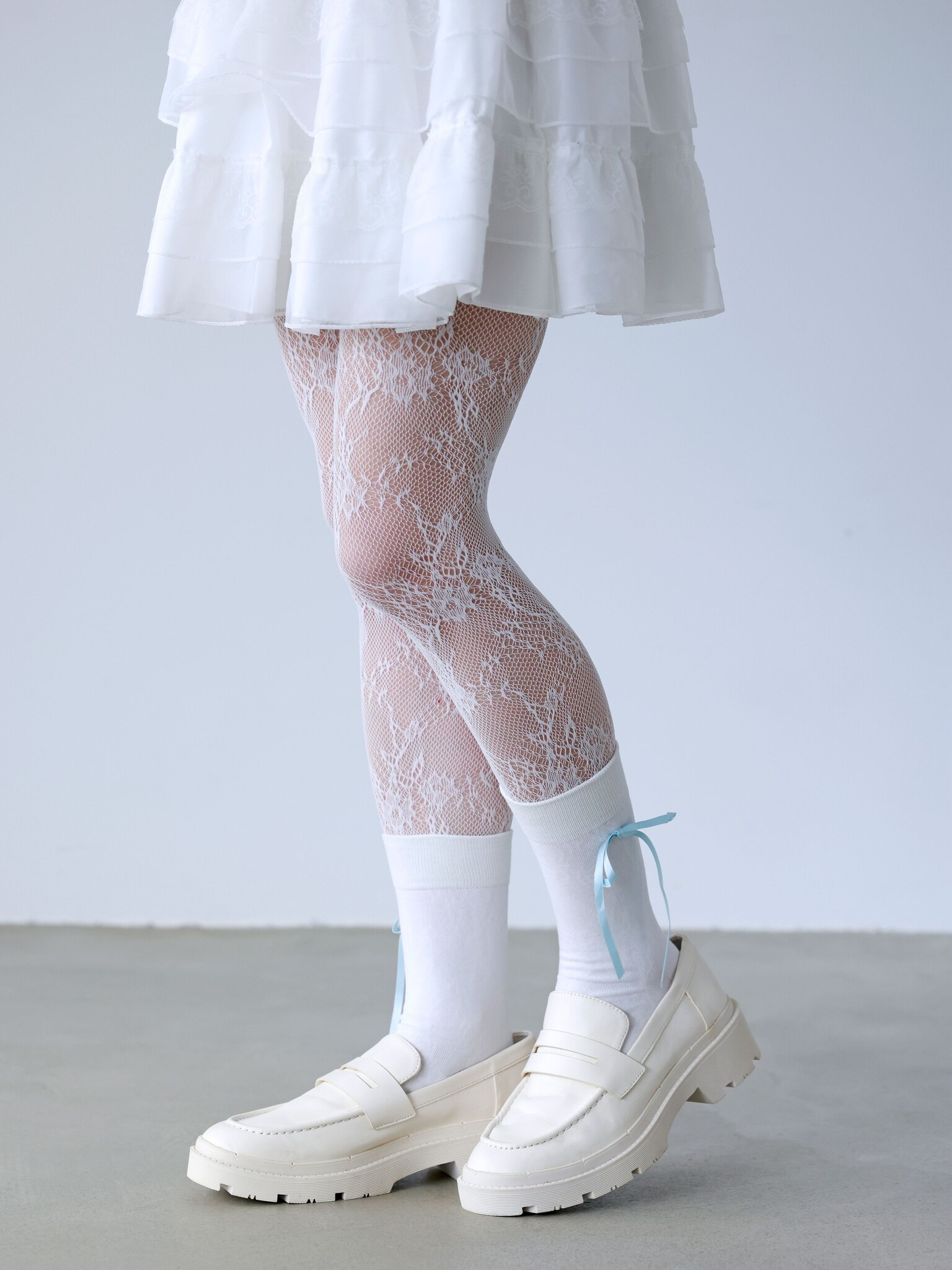 Collant Raschel fleurs en dentelle