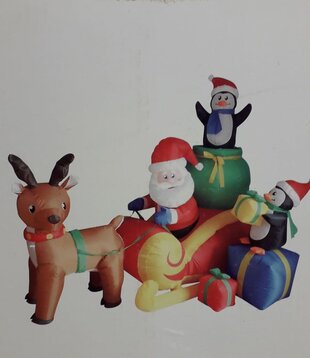 Scène de Noël gonflable avec le Père Noël et son traîneau à rennes
