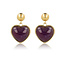 My Bendel Hartvormige Gouden Oorstekers met Amethyst Hart