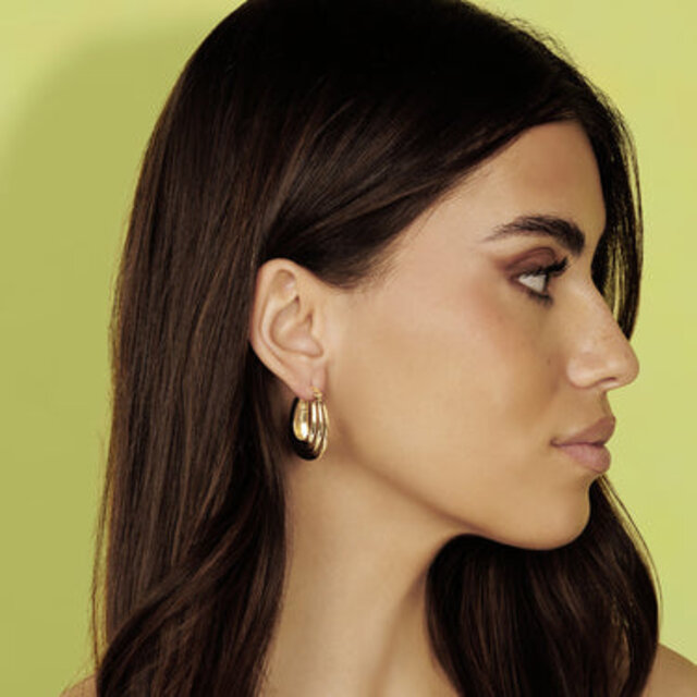 Gouden Ovale Ribbel Oorbellen - Speelse Elegantie 25mm