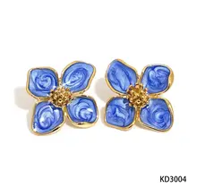 Stainless steel bloem oorbellen blauw – goudkleurige statement studs