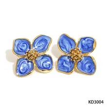 Stainless steel bloem oorbellen blauw – goudkleurige statement studs