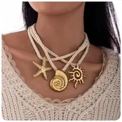 Statement Ketting Touw met Zee Bedels Goud – Schelp, Zeester & Zon Hangers