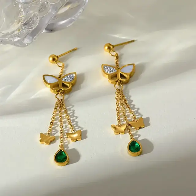 Stainless steel vlinder oorbellen met hanger – goudkleurige statement earrings