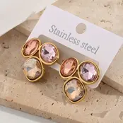 Goudkleurige stainless steel oorbellen met multicolor stenen – statement studs