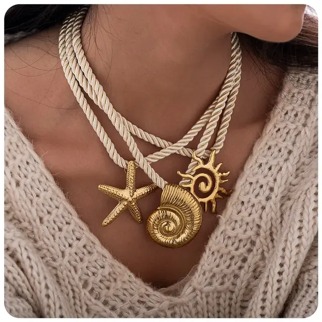 Statement Ketting Touw met Zee Bedels Goud – Schelp, Zeester & Zon Hangers
