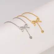 Stainless Steel Ketting Strikje met Steentje – Goud- en Zilverkleurig