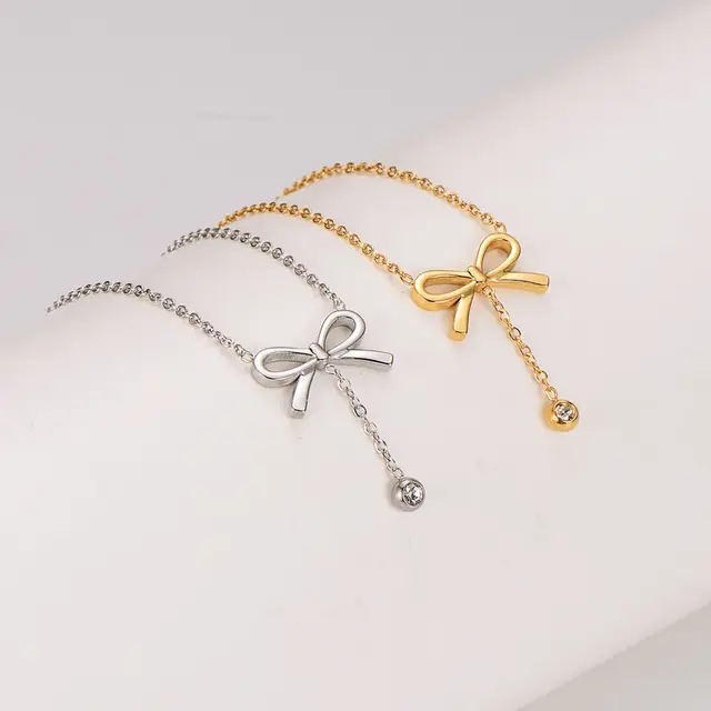 Stainless Steel Ketting Strikje met Steentje – Goud- en Zilverkleurig