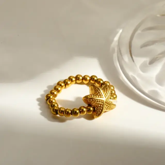 Elastische Stainless Steel Ring Zeester – Goud, Two Tone of Parel