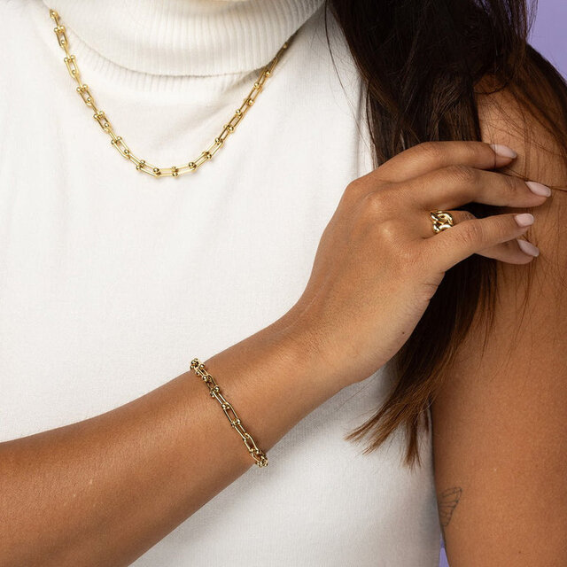 Gouden dames schakelarmband met bolletjes