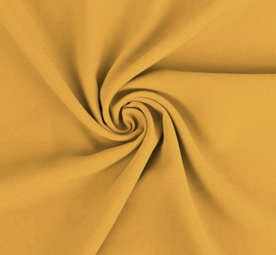 Okergele terlenka stof – Warme en trendy kleur voor mode en interieur