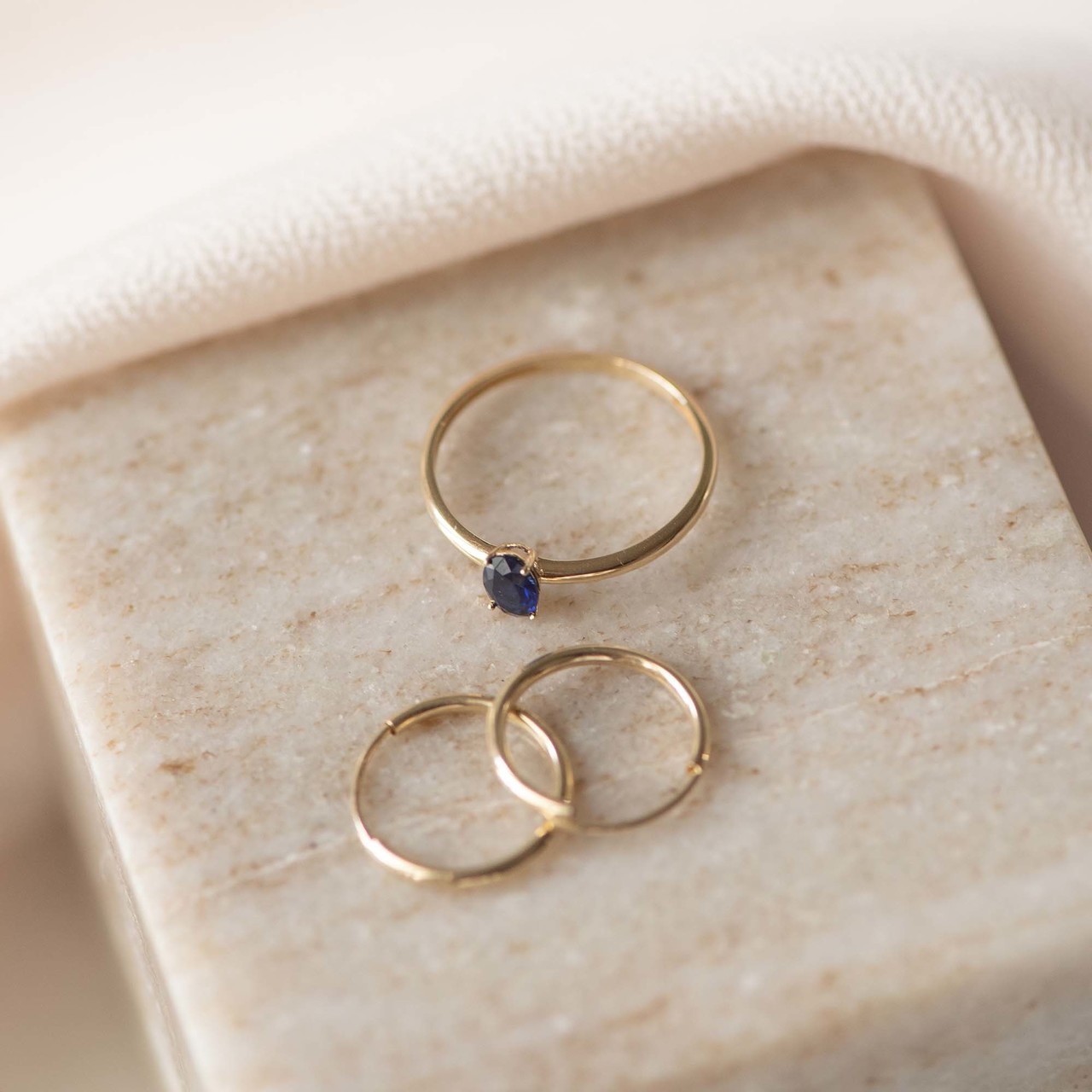 Isabel Bernard Baguette Nila 14 karat gold ring with blue zirconia stone