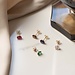 Isabel Bernard Baguette Roux 14 karat gold stud ear studs with red zirconia stone