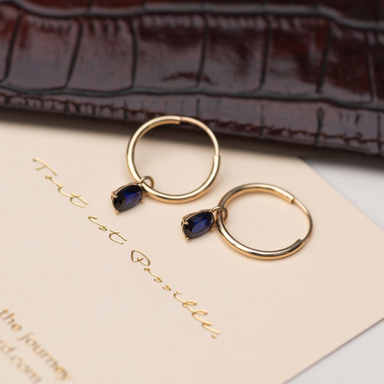 Isabel Bernard Baguette Nila 14 karat gold hoop earrings with blue zirconia stone