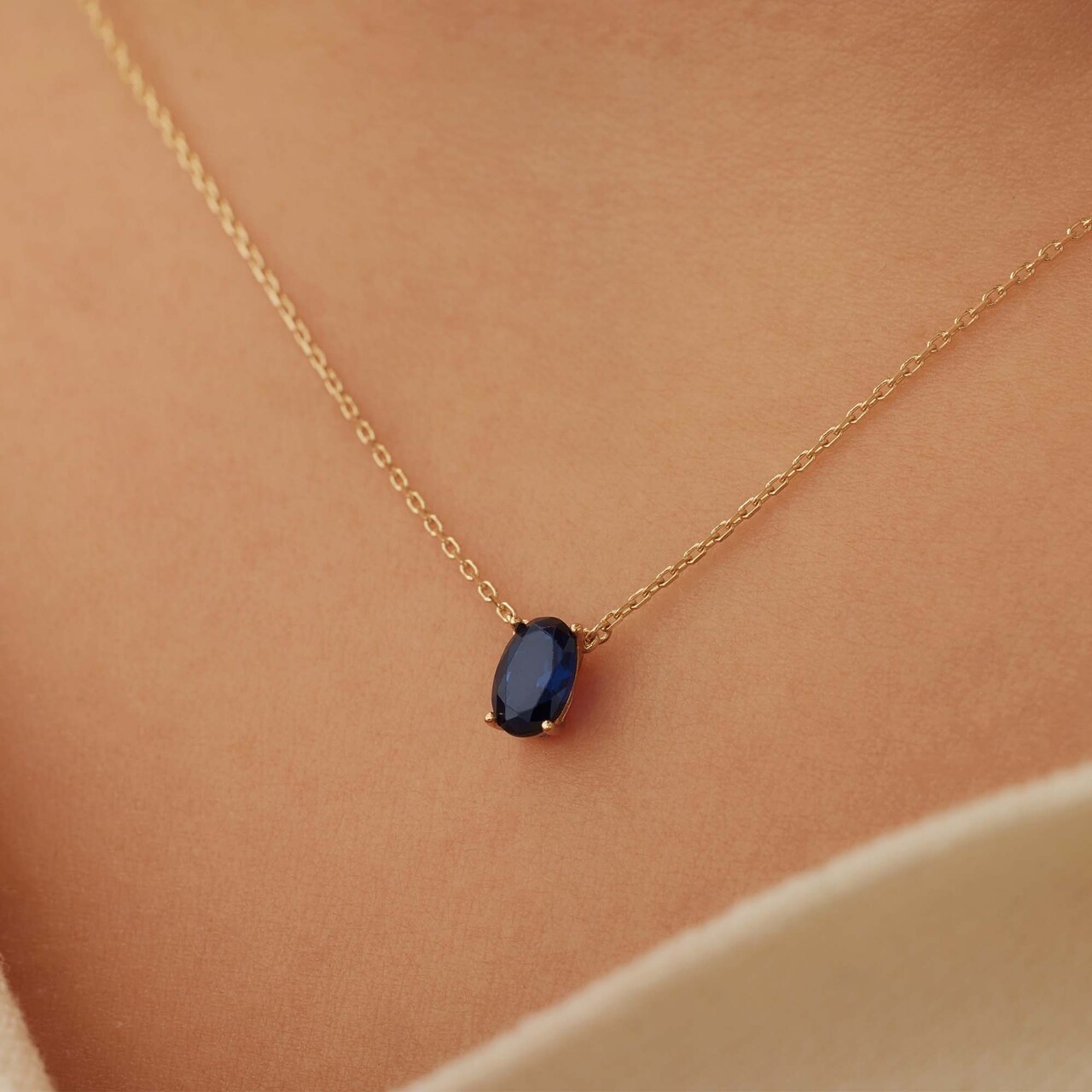 Isabel Bernard Baguette Nila 14 karat gold necklace with blue zirconia stone